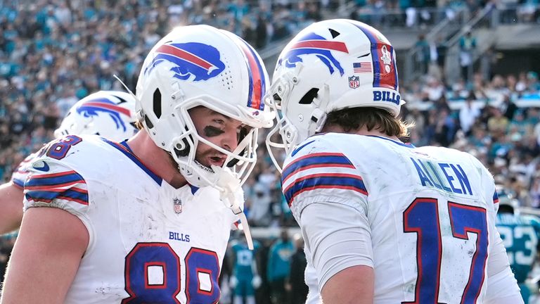 Buffalo Bills quarterback Josh Allen (17) celebrates his touchdown with tight end Dawson Knox (88) during the second half of their NFL Wild Card playoff against the Jacksonville Jaguars