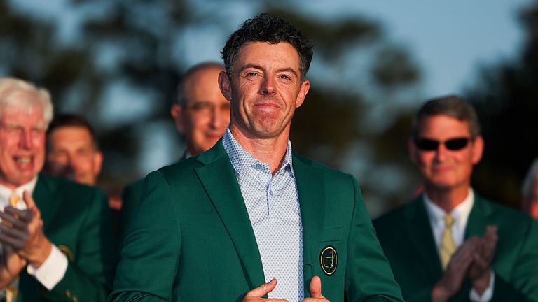 Rory McIlroy of Northern Ireland reacts after being awarded the Green Jacket during the Green Jacket Ceremony after winning the final round